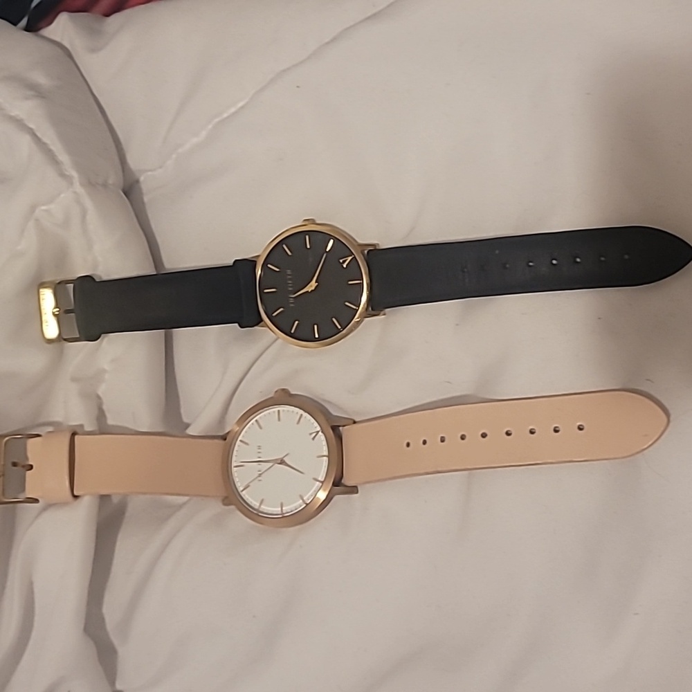 The Fifth Label Rose Gold Watch with Black Leather Band and Gold Black Band.